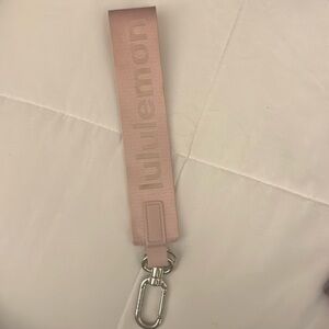 Light pink lululemon never lost keychain